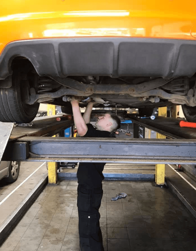 Mechanic working on a car